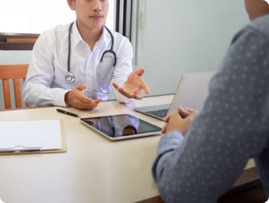 Two doctors smiling at the camera