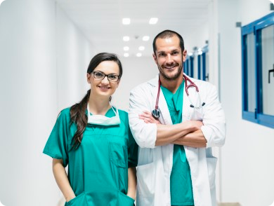 Two doctors smiling at the camera